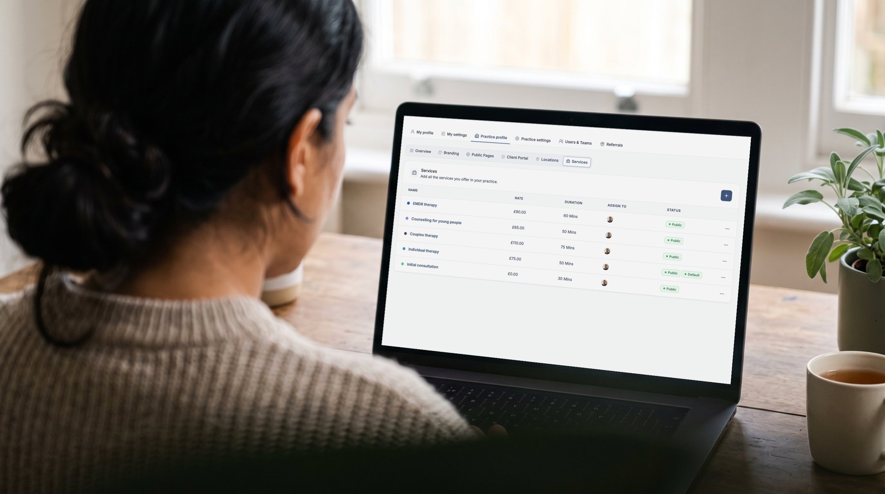 Over the shoulder of a therapist using Therasee: set up your practice