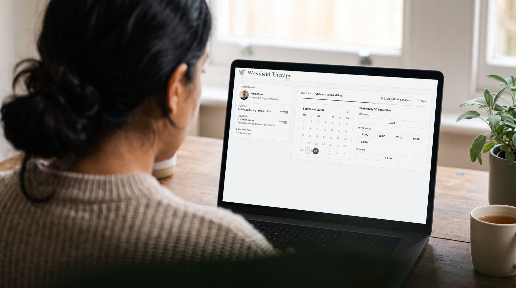 Over the shoulder of a therapist using Therasee: share your booking page
